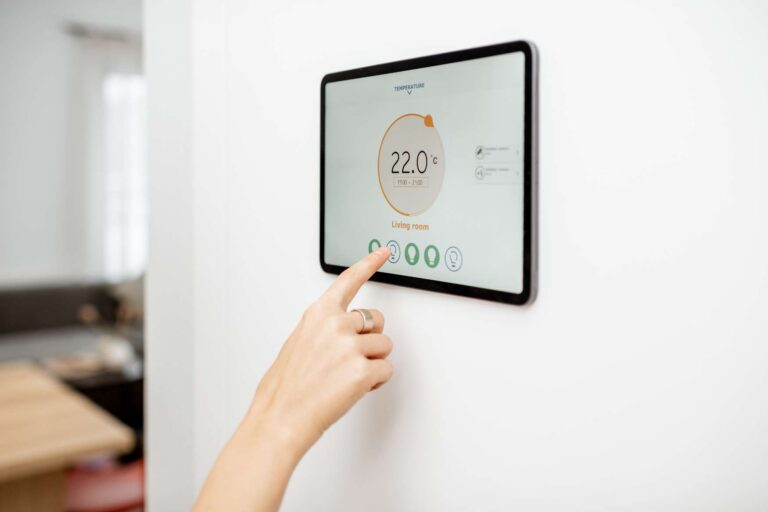 woman-controlling-heating-with-a-smart-devices-